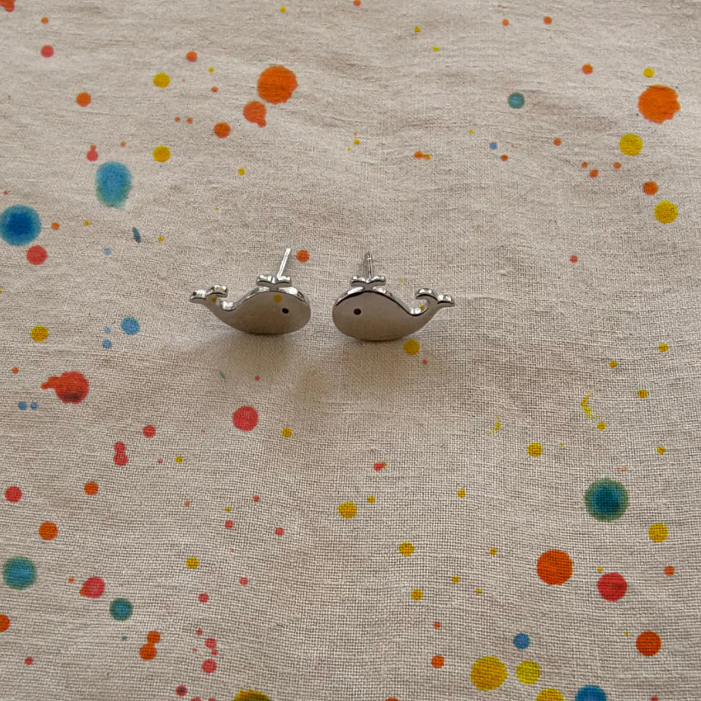 Whale Sterling Silver Stud Earrings on linen fabric