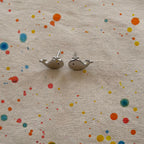 Whale Sterling Silver Stud Earrings on linen fabric
