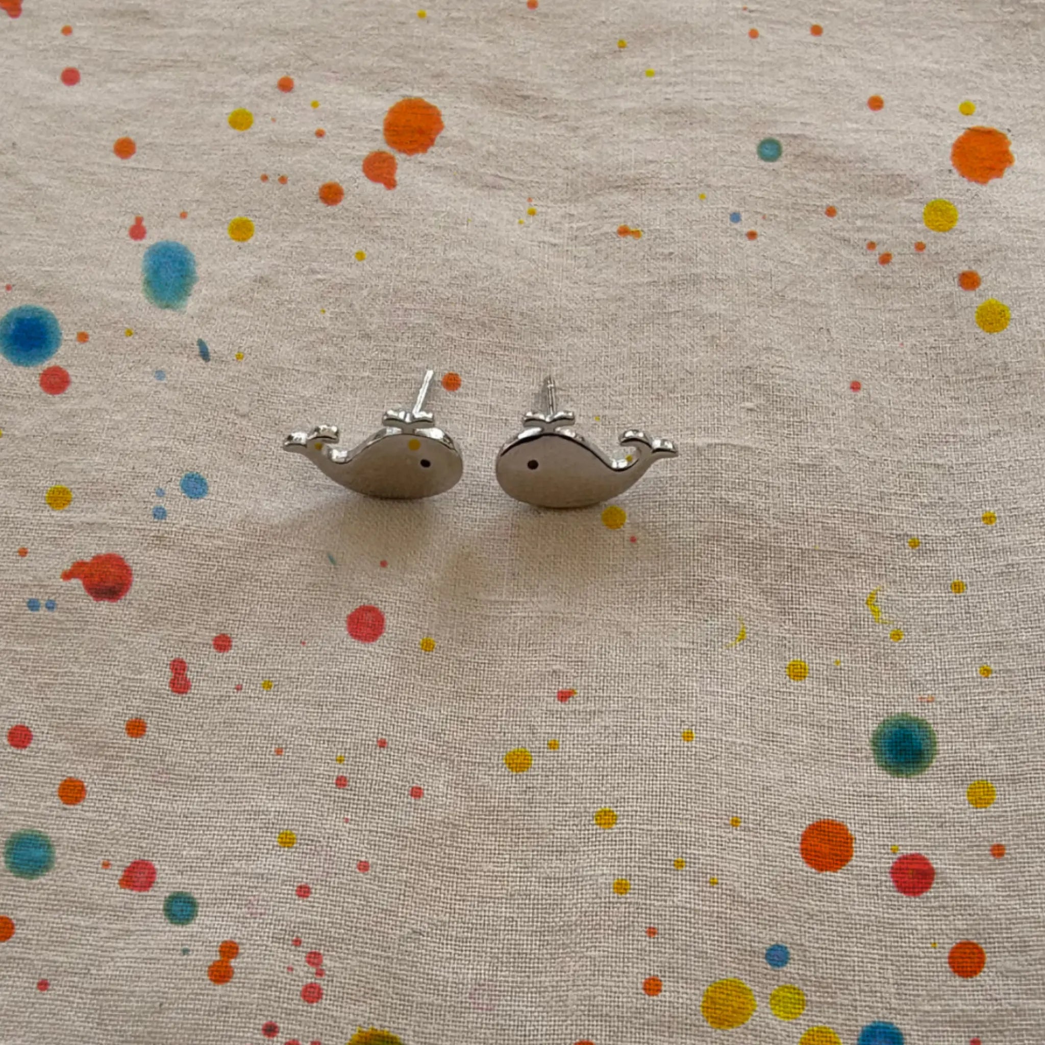 Whale Sterling Silver Stud Earrings on linen fabric